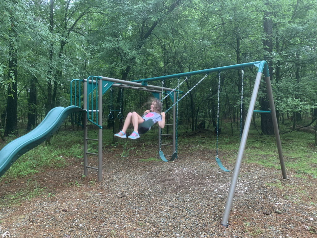 a girl on a swing set