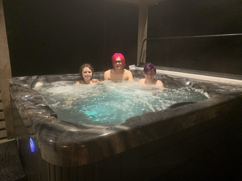 a group of people in a hot tub