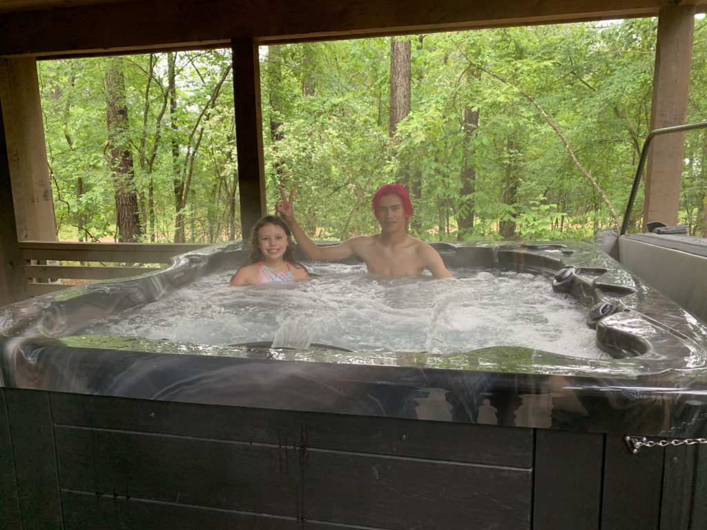 a man and a girl in a hot tub