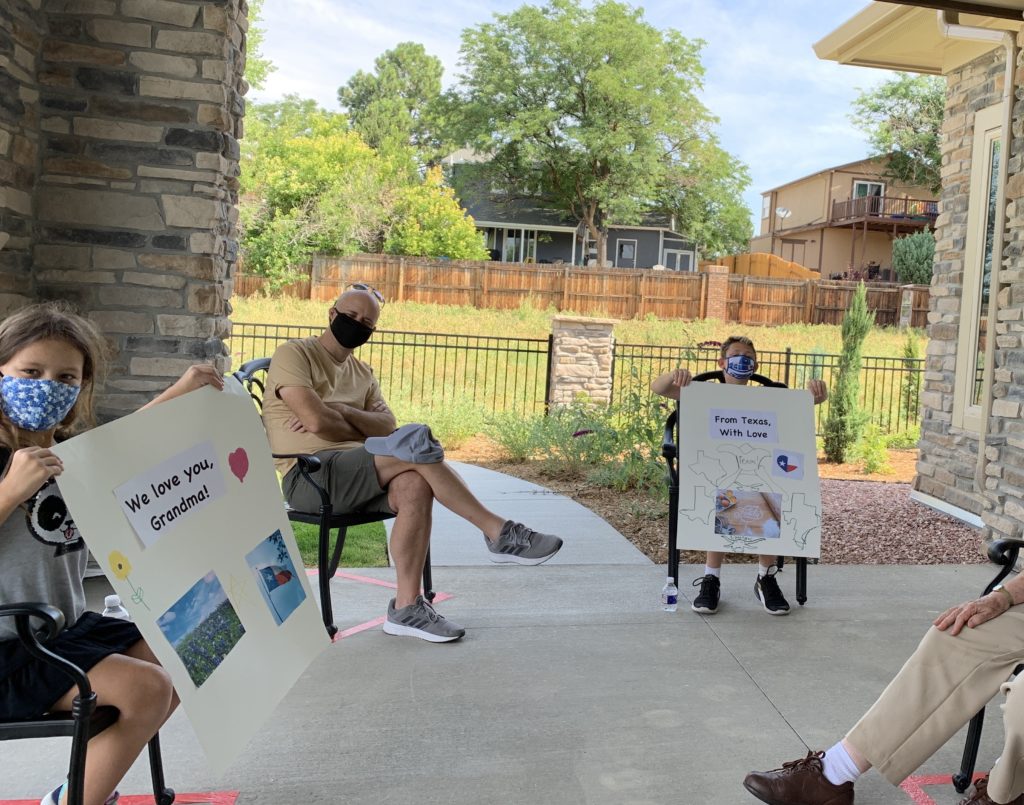 a group of people sitting outside