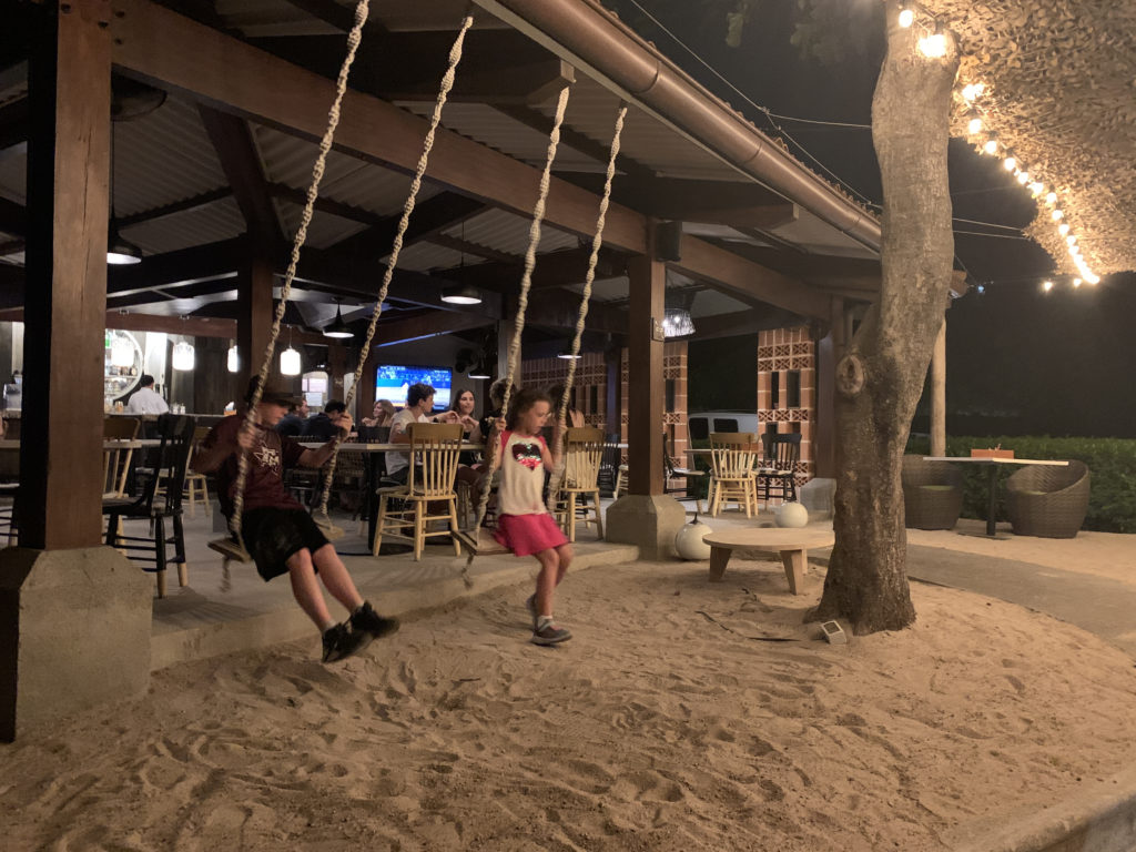 a group of people on a swing
