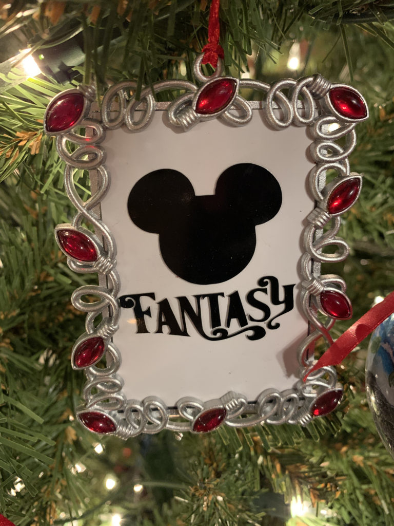 a christmas tree decoration with a picture frame