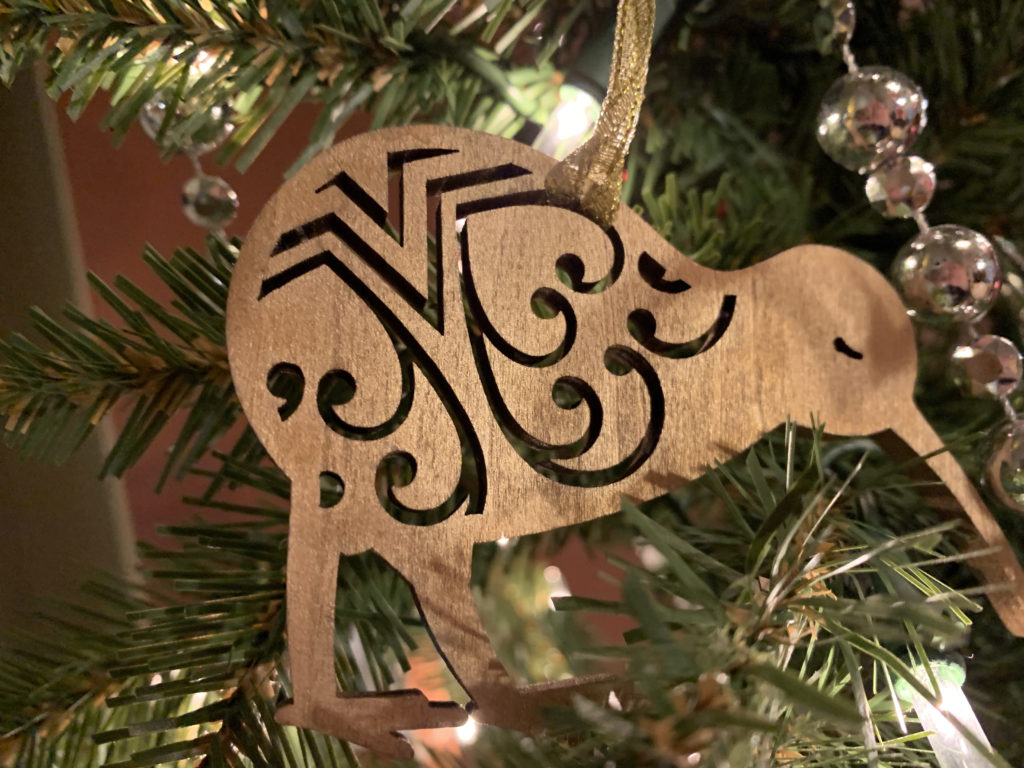 a wooden ornament on a tree