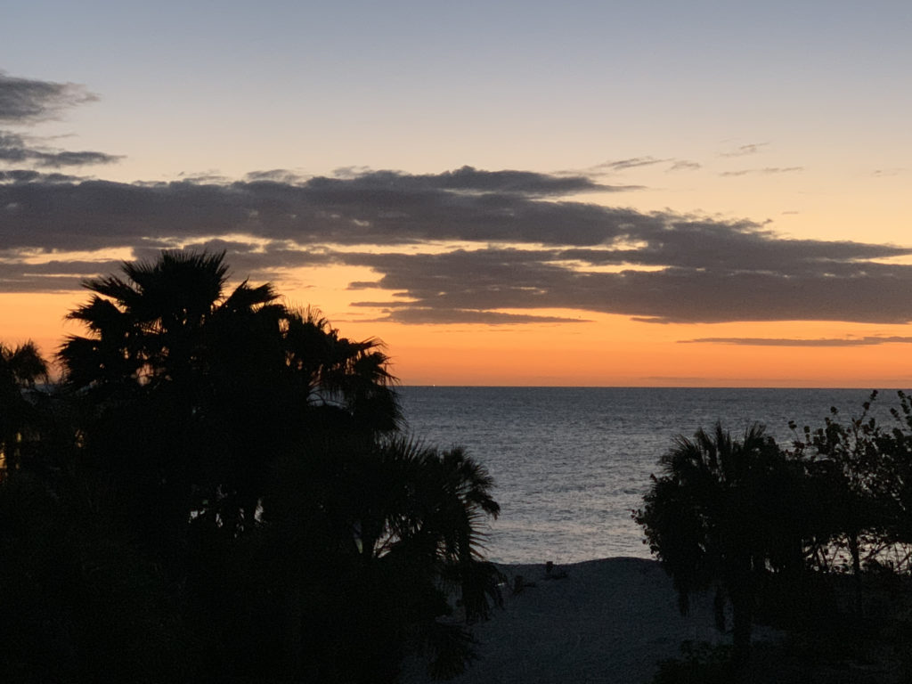 a sunset over a beach