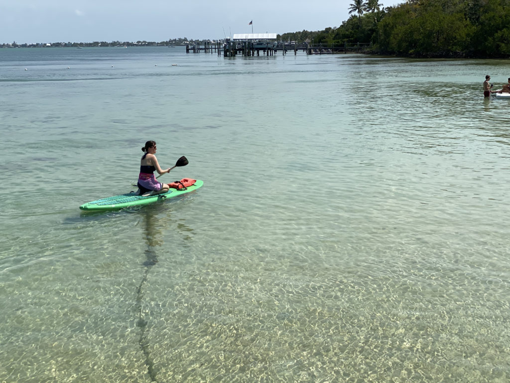 a woman on a surfboard in the water