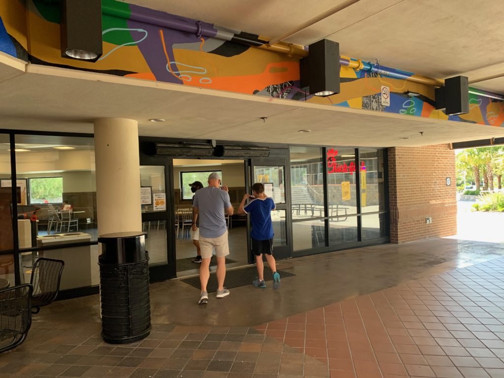 people standing in front of a building