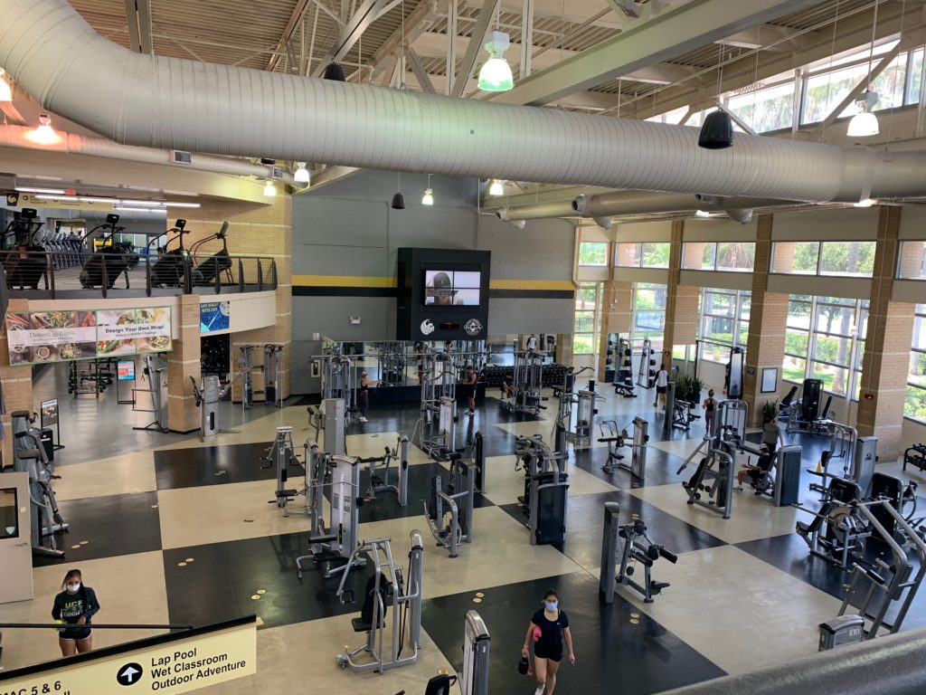a large gym with many exercise equipment