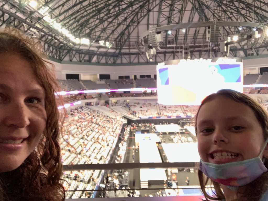 two people taking a selfie in a stadium