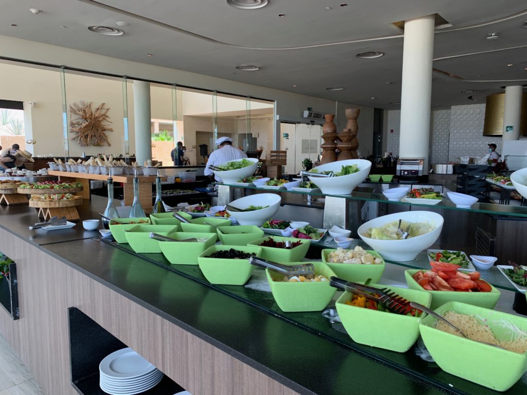 a buffet with many bowls of food