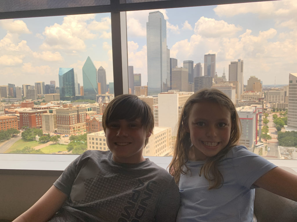 a boy and girl posing for a picture