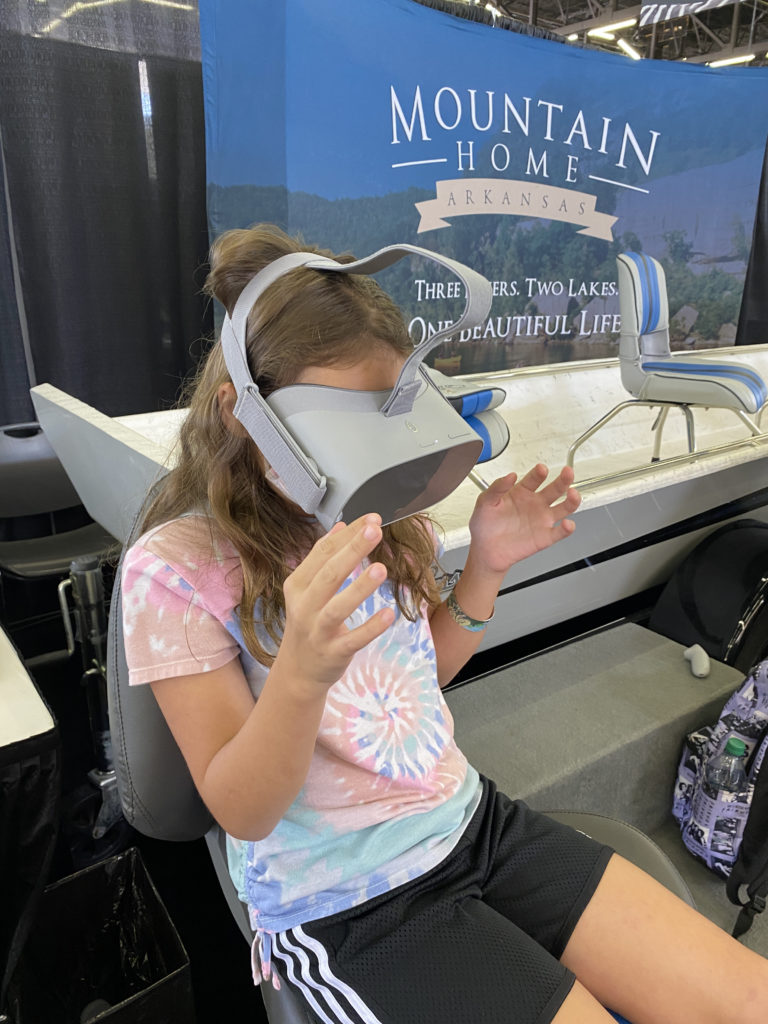 a girl wearing a virtual reality device