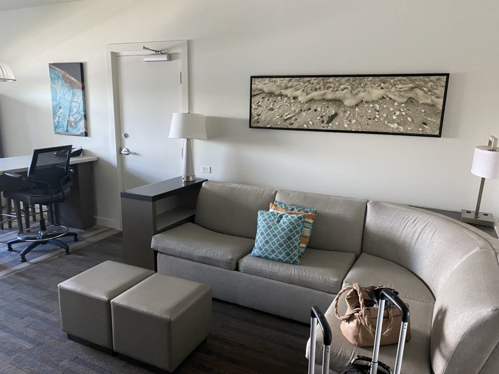 a room with a couch and a chair