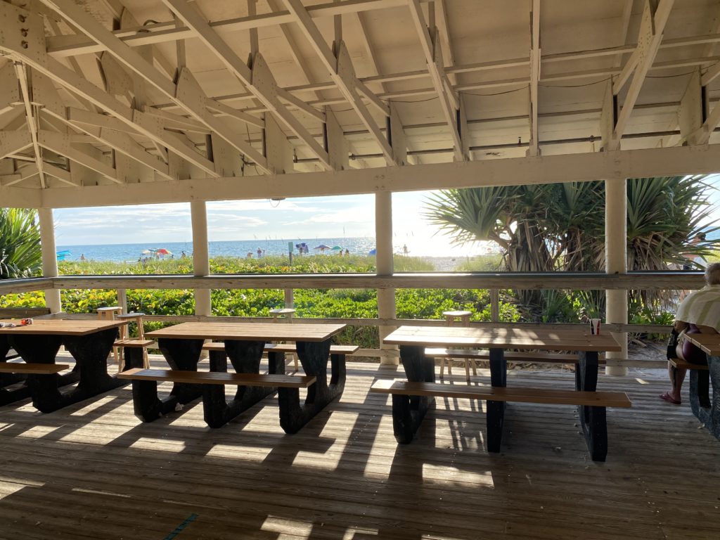 a picnic table and benches on a deck