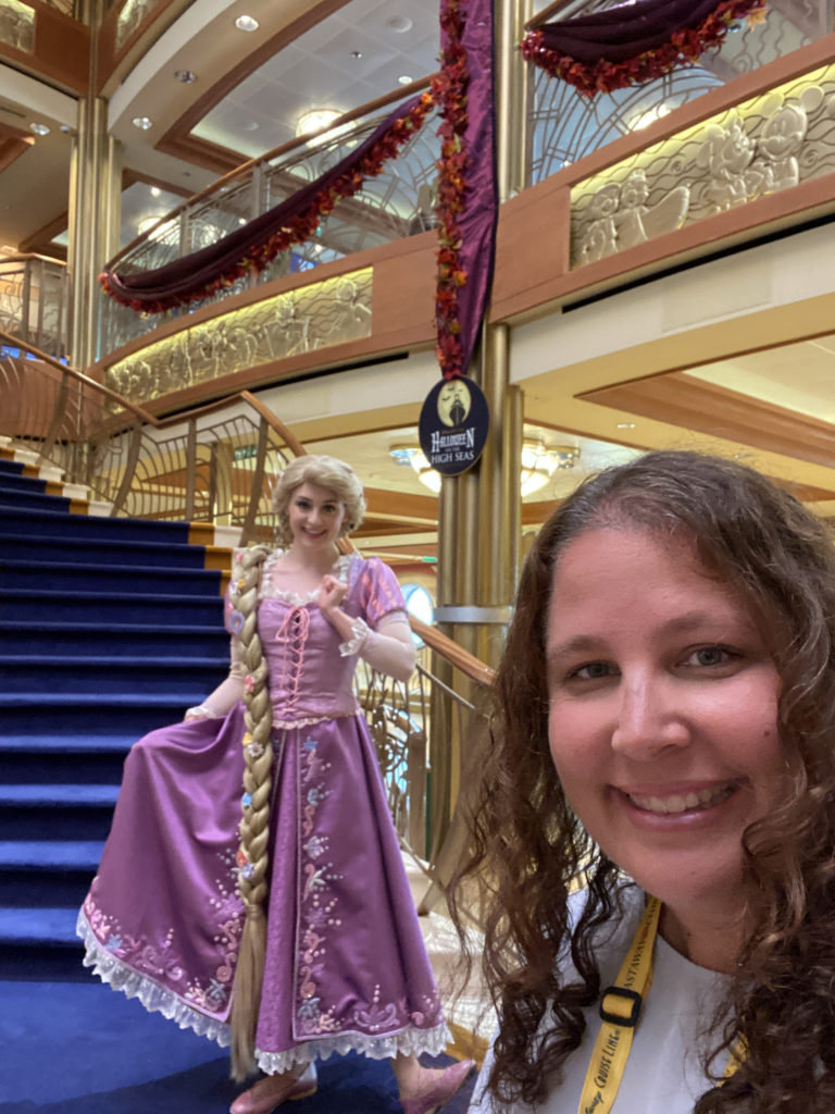 a woman taking a selfie with a woman in a dress