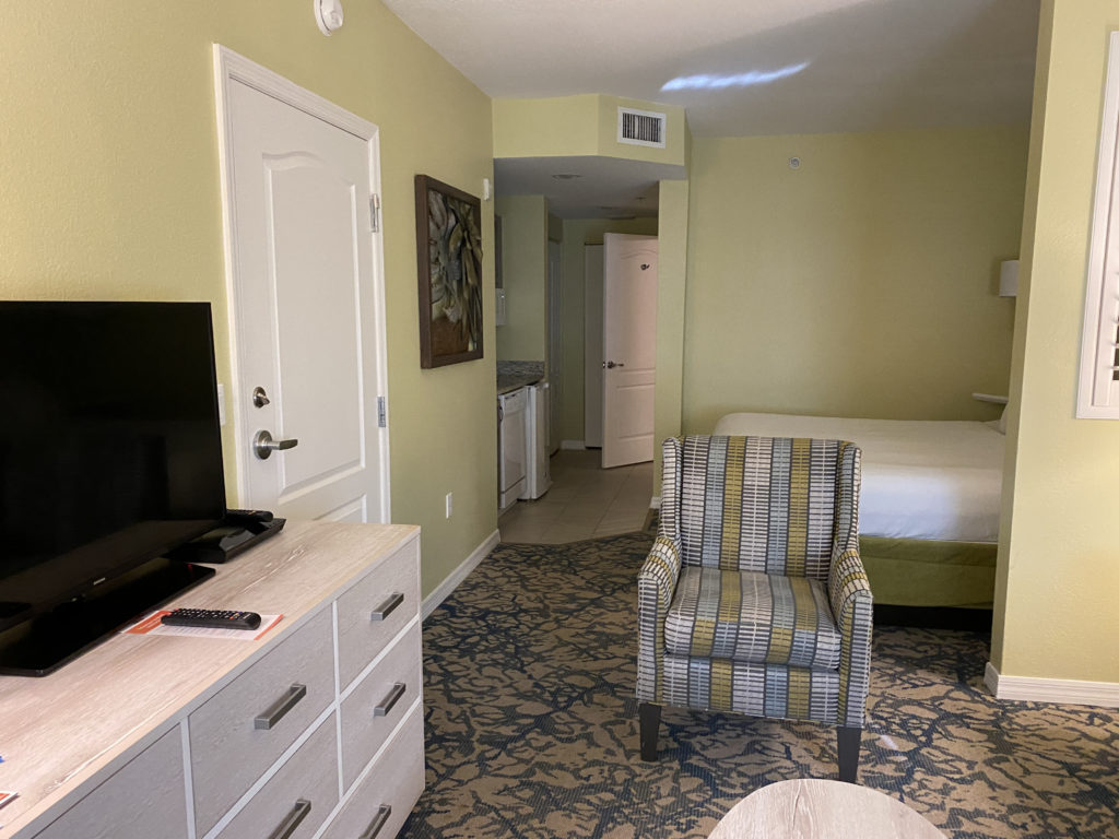 a room with a bed and a chair