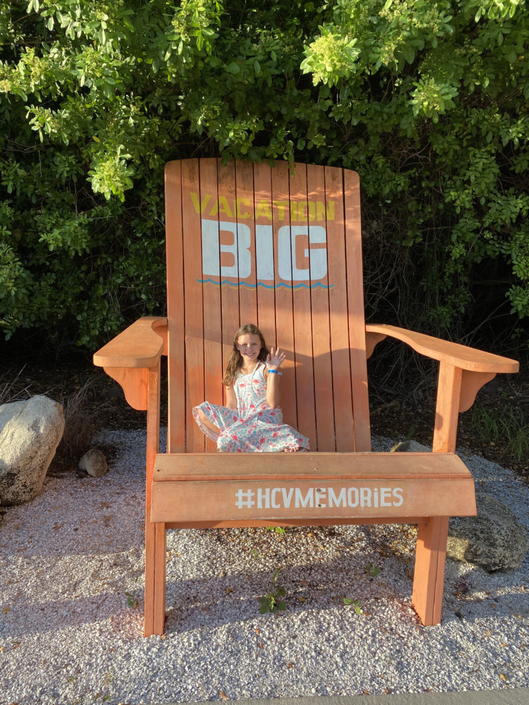 a girl sitting in a large chair
