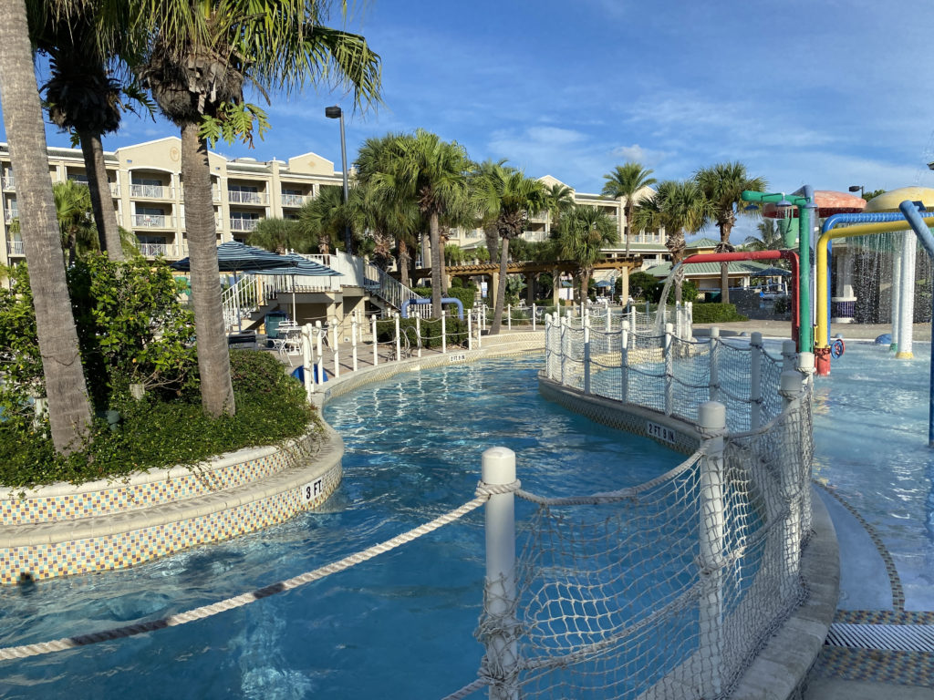 a pool with a water slide and a water park
