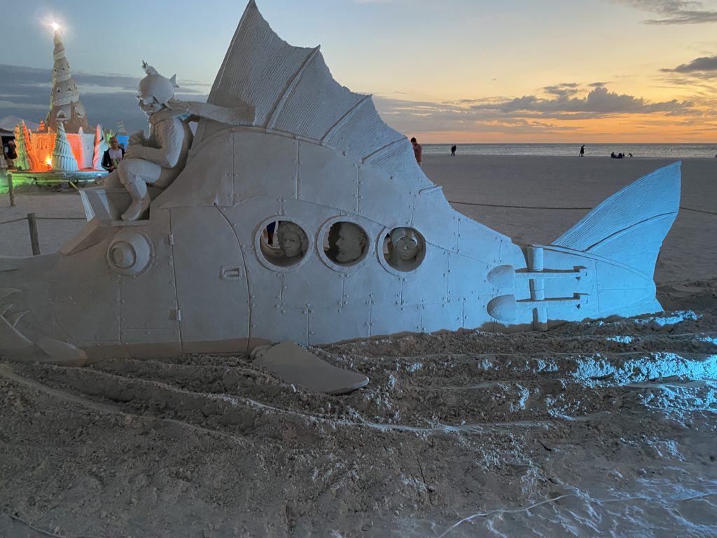 a sand sculpture of a submarine