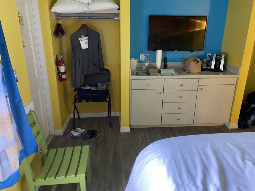 a room with a tv and a bed