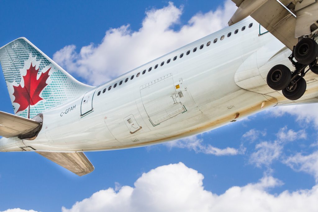 a white airplane in the sky