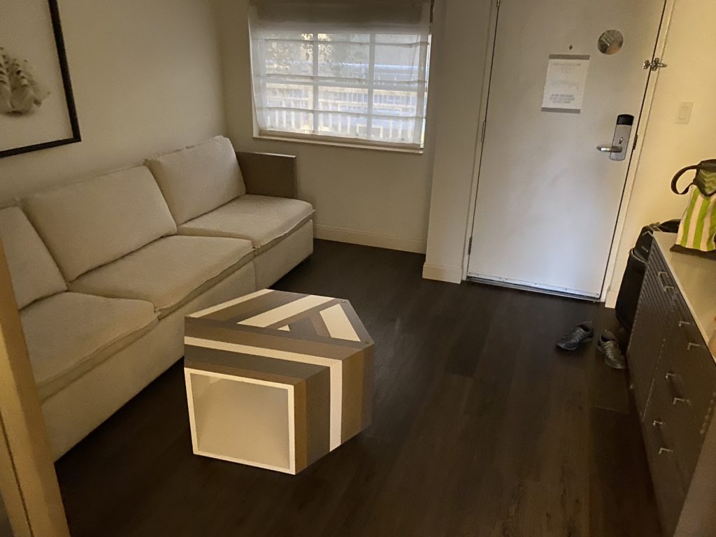 a room with a couch and a box