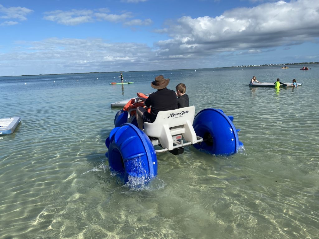 a man on a small vehicle in the water