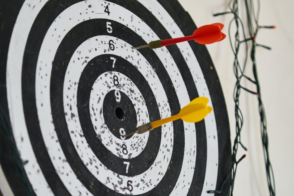 a dart board with darts in the center