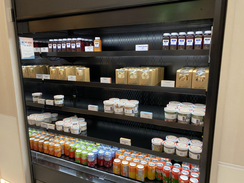 a shelf with different drinks and beverages