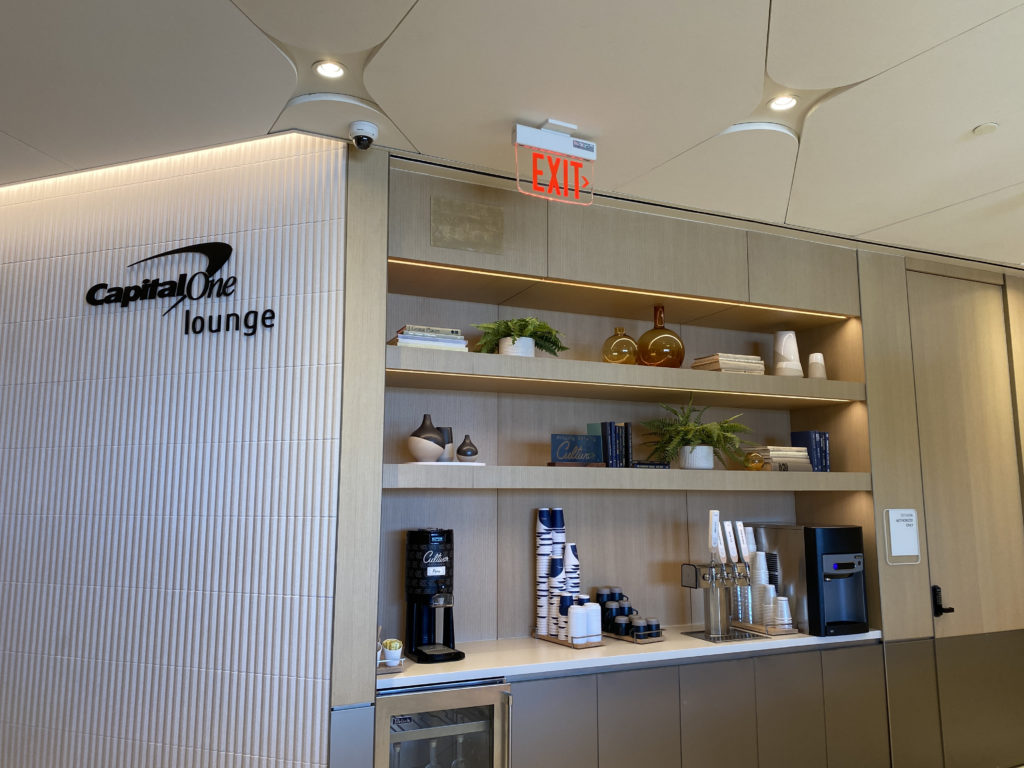 a room with a sign and shelves