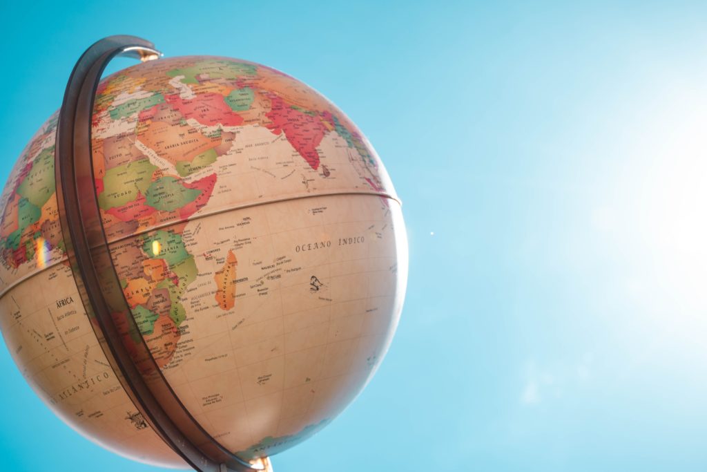 a globe with a blue sky