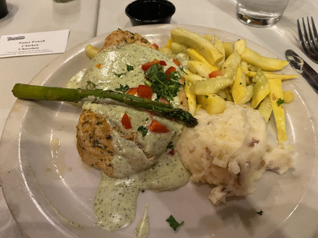 a plate of food with asparagus and potatoes