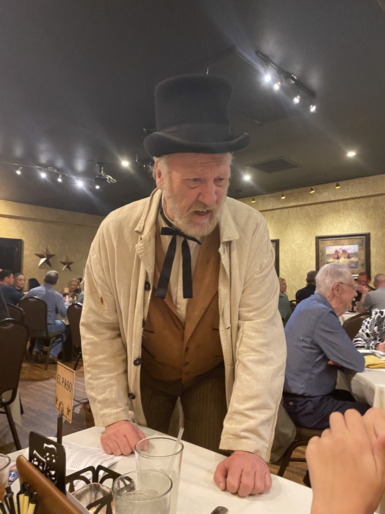 a man in a hat and a black top hat