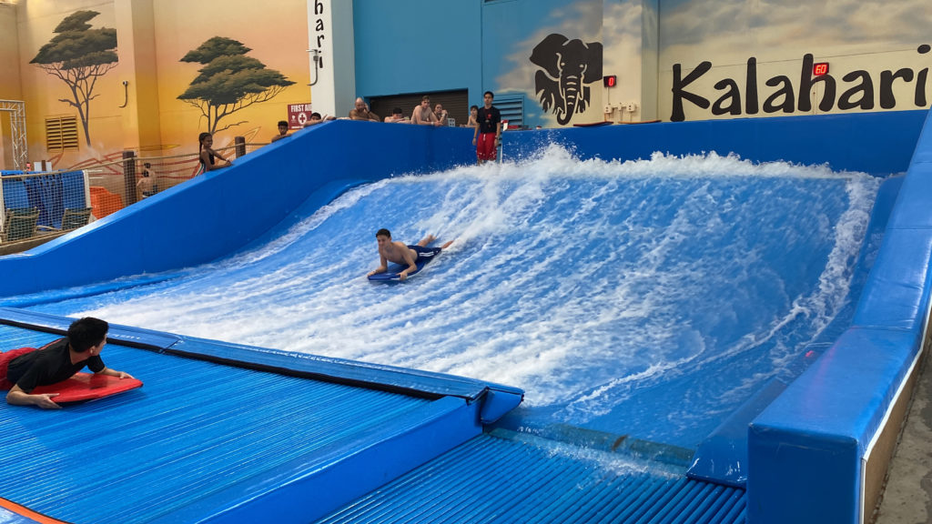a man on a surfboard on a wave