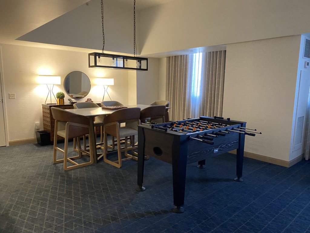 a room with a table and chairs