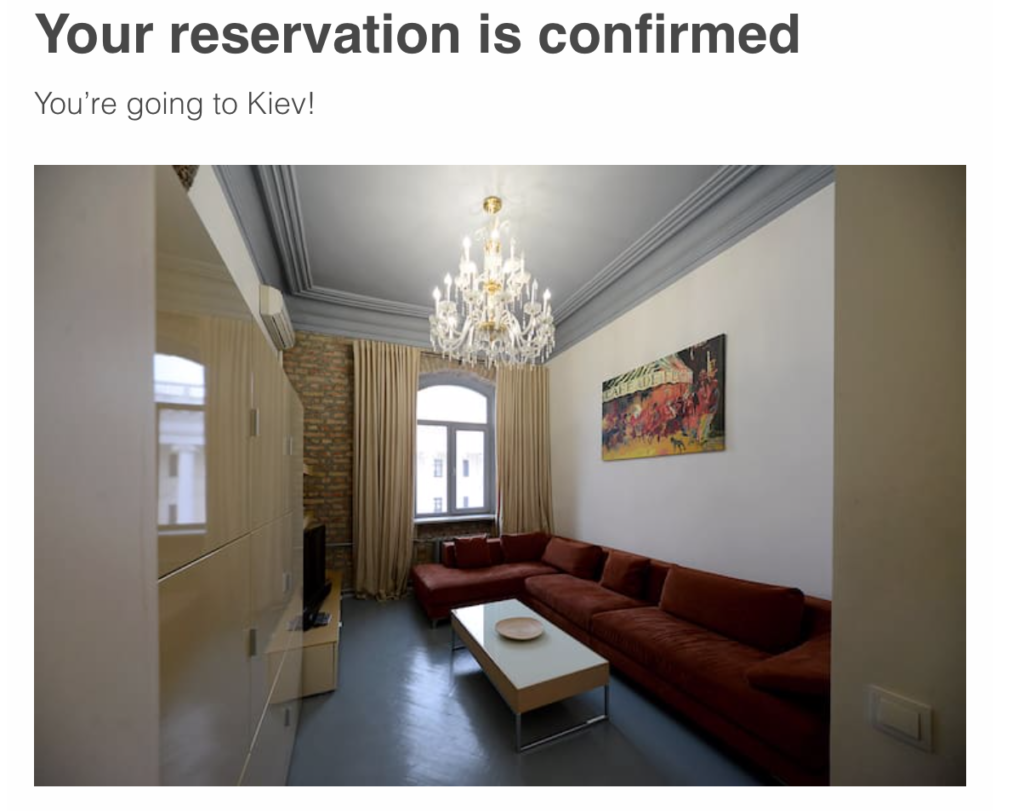 a room with a couch and a chandelier