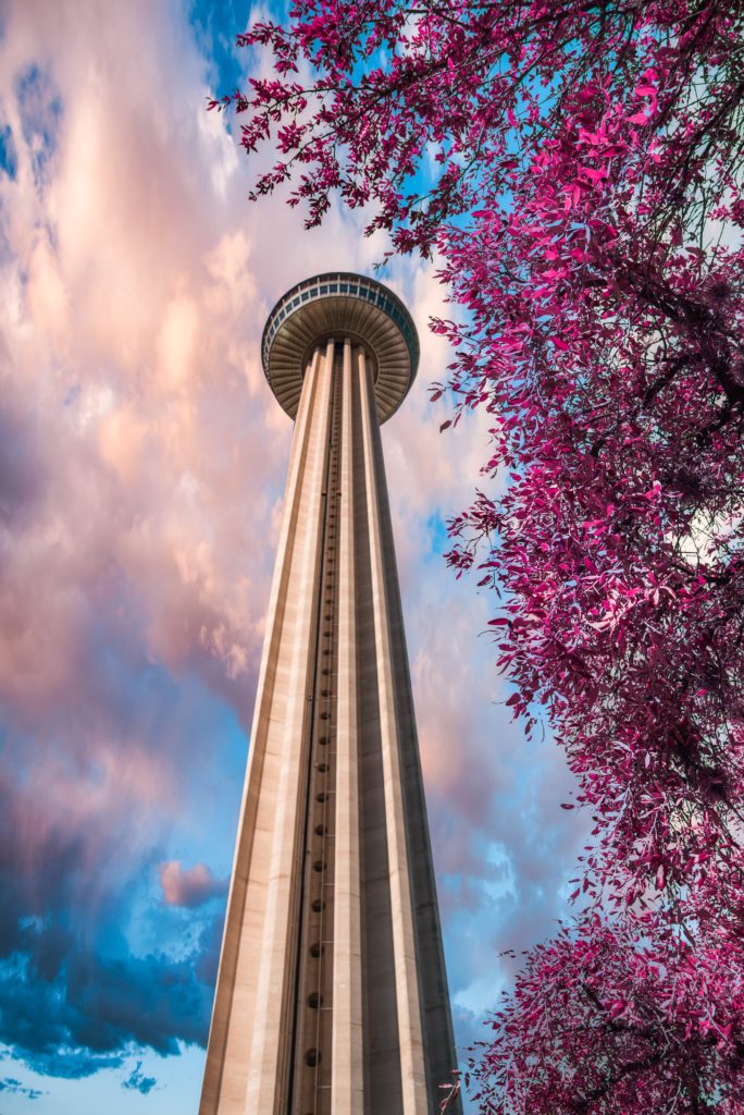 a tall tower with a round top and a round roof