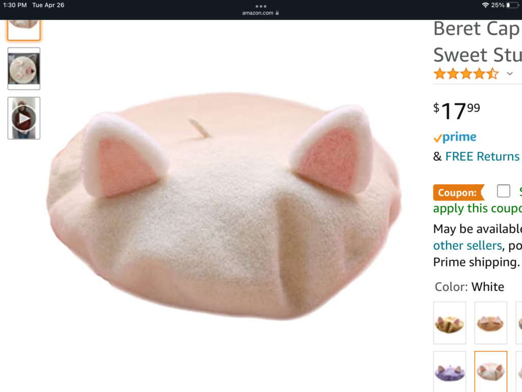 a white cat shaped pillow