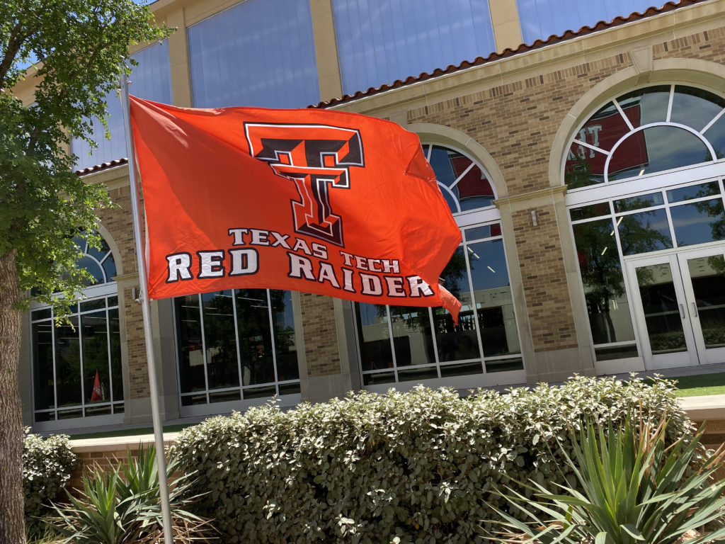 a flag in front of a building