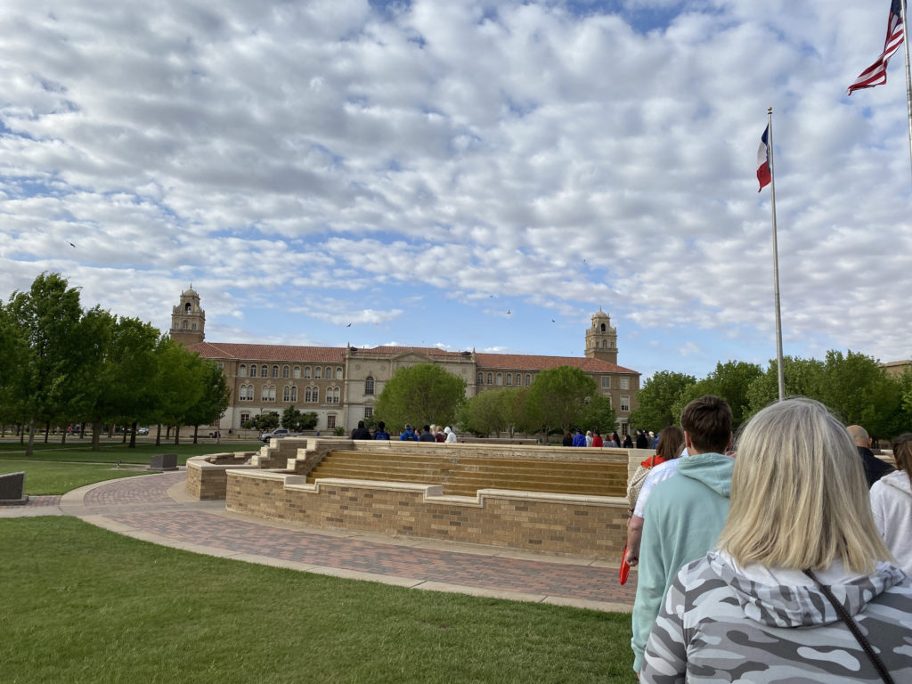 a group of people standing in a park