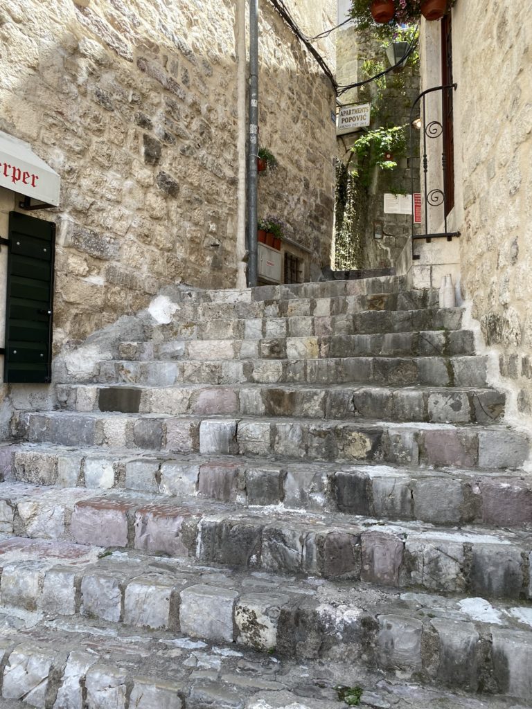 a stone stairs leading up to a building