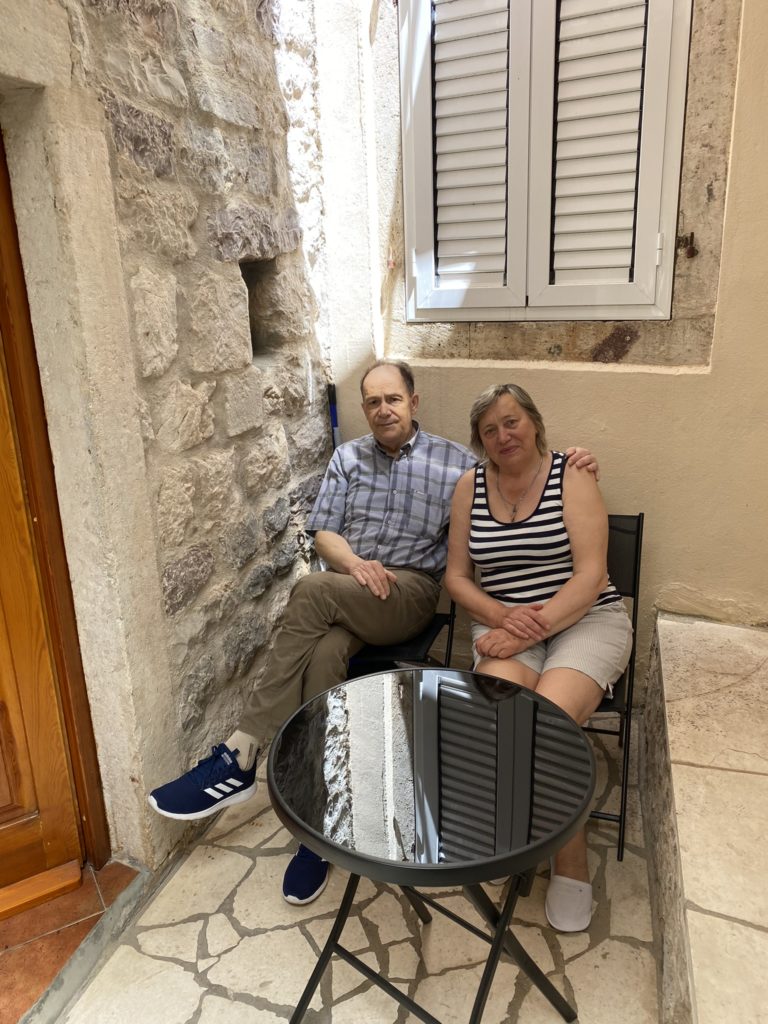 a man and woman sitting in a chair