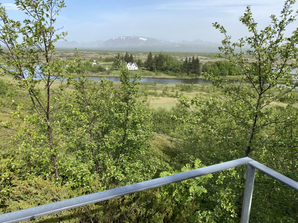 a view of a river and a house from a balcony