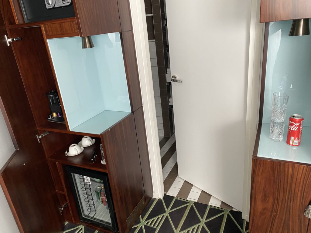 a door and cupboard in a room