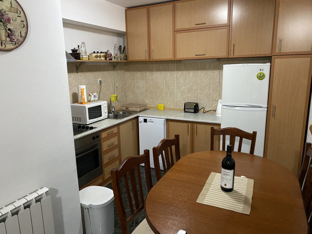 a kitchen with a table and chairs