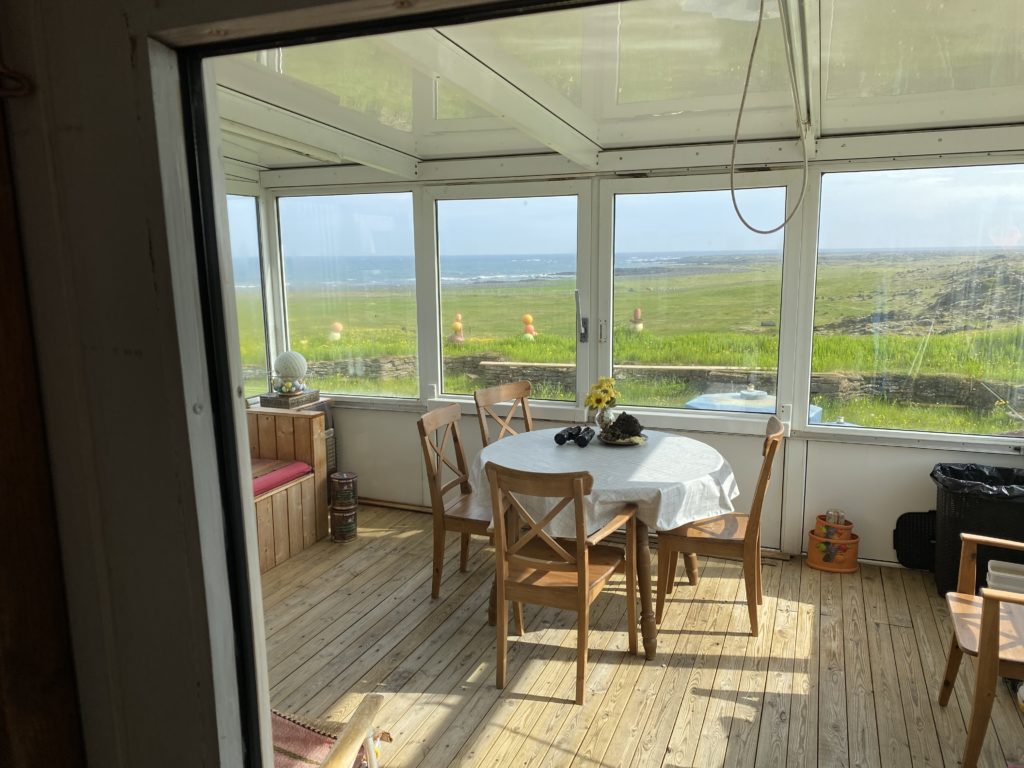 a room with a table and chairs