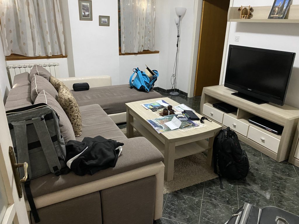 a living room with a couch and a tv
