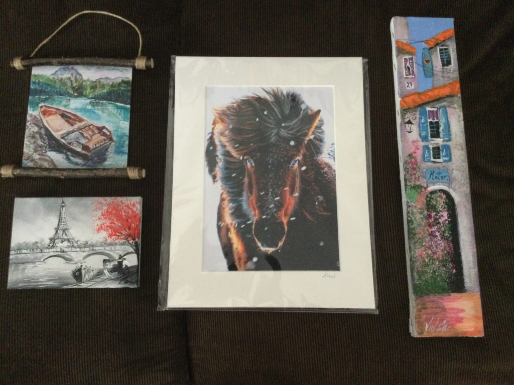a group of paintings on a table
