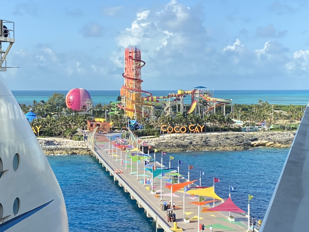 a boardwalk with a slide and a water park
