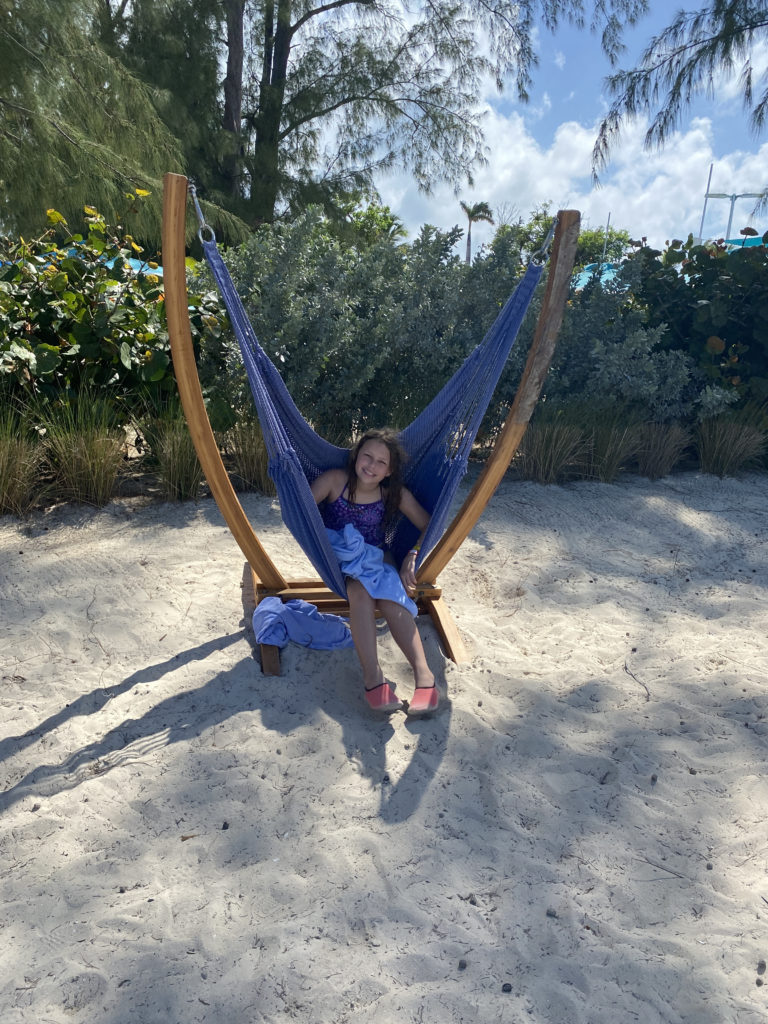 a girl sitting in a hammock
