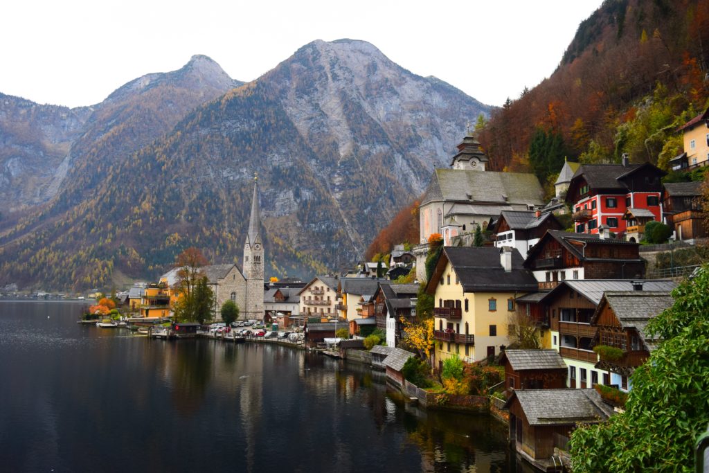 a town next to a body of water with Hallstatt in the background